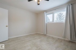 Spare room featuring a ceiling fan and light flooring - 