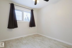 Unfurnished room featuring baseboards and ceiling fan - 