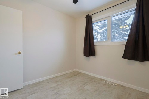 Spare room featuring baseboards - 13419 102 Street, Edmonton, AB - Indoor Photo Showing Other Room