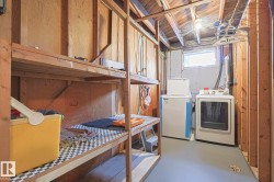 Below grade area with washer and dryer - 