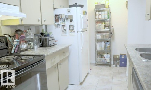 111 5125 Riverbend Road, Edmonton, AB - Indoor Photo Showing Kitchen With Double Sink