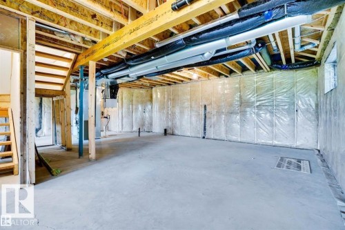 Unfinished basement featuring heating unit - 27 Rosewood Way, St. Albert, AB - Indoor Photo Showing Basement