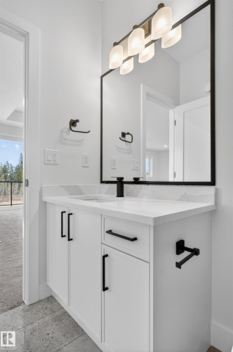 Contemporary bathroom vanity with a white countertop and integrated sink - 27 Redpoll Wynd, St. Albert, AB - Indoor