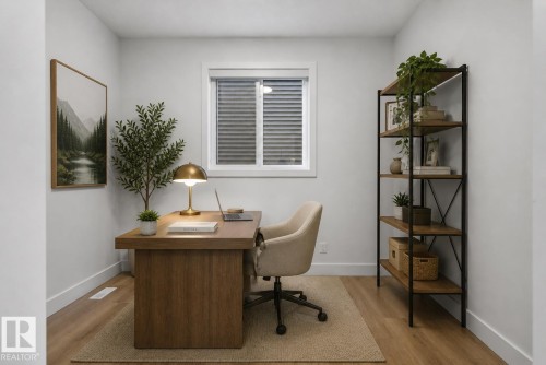Dedicated room featuring wood-finish flooring, a window with blinds, and white baseboards - 27 Redpoll Wynd, St. Albert, AB - Indoor Photo Showing Office