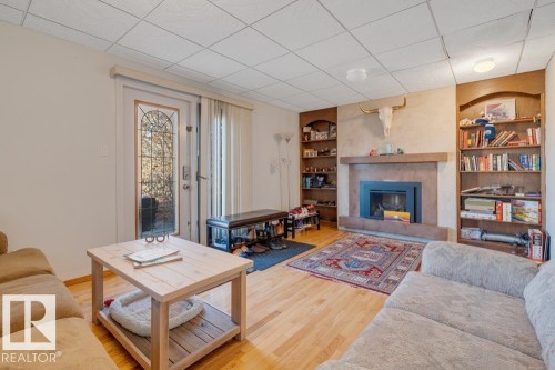 5004 144 Street, Edmonton, AB - Indoor Photo Showing Living Room With Fireplace