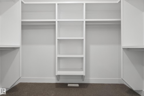 View of walk in closet - 19 Rosa Crescent, St. Albert, AB - Indoor With Storage
