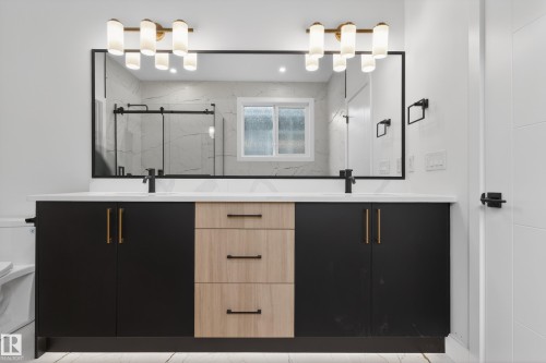 Bathroom with double vanity and a marble finish shower - 19 Rosa Crescent, St. Albert, AB - Indoor