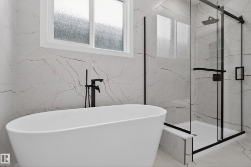 Full bathroom with a marble finish shower, a soaking tub, and marble tiled flooring - 19 Rosa Crescent, St. Albert, AB - Indoor Photo Showing Bathroom