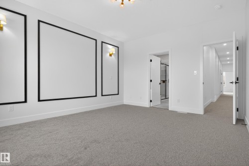 Unfurnished bedroom featuring light carpet and ensuite bathroom - 19 Rosa Crescent, St. Albert, AB - Indoor Photo Showing Other Room