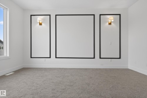 Carpeted spare room featuring baseboards - 19 Rosa Crescent, St. Albert, AB - Indoor Photo Showing Other Room