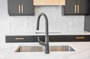Kitchen view of light stone counters and decorative backsplash - 19 Rosa Crescent, St. Albert, AB  - Indoor Photo Showing Kitchen With Double Sink 