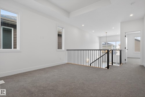 Carpeted empty room with baseboards and recessed lighting - 19 Rosa Crescent, St. Albert, AB - Indoor Photo Showing Other Room