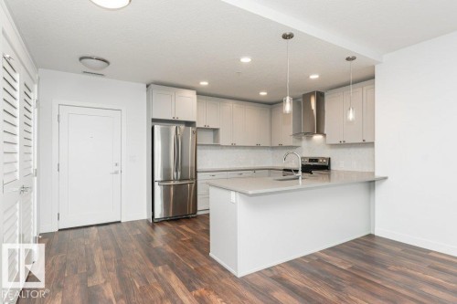 306 1316 Windermere Way, Edmonton, AB - Indoor Photo Showing Kitchen With Stainless Steel Kitchen
