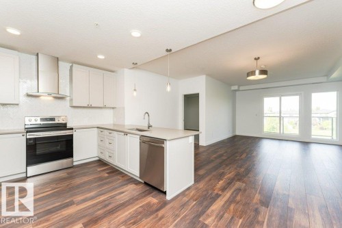 306 1316 Windermere Way, Edmonton, AB - Indoor Photo Showing Kitchen With Stainless Steel Kitchen With Upgraded Kitchen