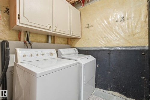 Laundry room with cabinet space and washer and dryer - 3014 31 Avenue, Edmonton, AB - Indoor Photo Showing Laundry Room
