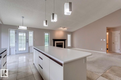 12416 29A Avenue, Edmonton, AB - Indoor Photo Showing Kitchen With Fireplace