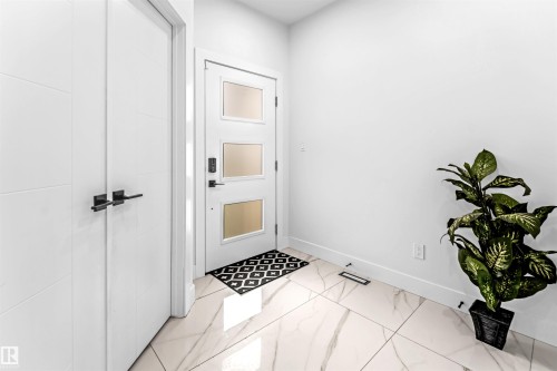 Entryway with baseboards - 15518 13A Avenue, Edmonton, AB - Indoor Photo Showing Other Room