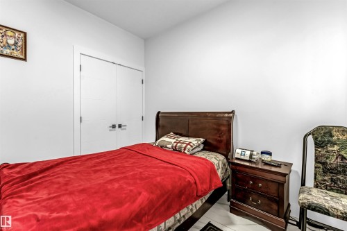 Bedroom featuring a closet - 15518 13A Avenue, Edmonton, AB - Indoor Photo Showing Bedroom