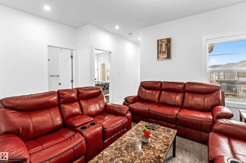Carpeted living room featuring recessed lighting - 15518 13A Avenue, Edmonton, AB - Indoor Photo Showing Living Room
