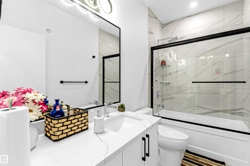 Full bathroom featuring vanity and combined bath / shower with glass door - 15518 13A Avenue, Edmonton, AB - Indoor Photo Showing Bathroom