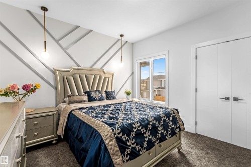 Bedroom with dark colored carpet - 15518 13A Avenue, Edmonton, AB - Indoor Photo Showing Bedroom