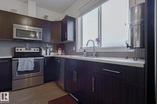 180 Southfork Drive, Leduc, AB - Indoor Photo Showing Kitchen With Double Sink