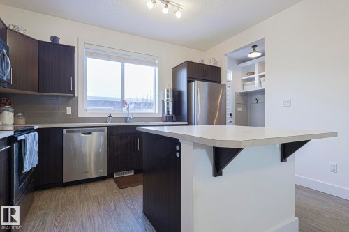 180 Southfork Drive, Leduc, AB - Indoor Photo Showing Kitchen With Upgraded Kitchen