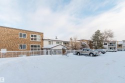 Snowy yard with a residential view - 