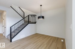 Staircase with wood finished floors and baseboards - 