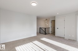 Spare room featuring carpet floors and recessed lighting - 
