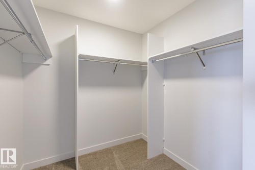 Spacious closet with light carpet - 3719 42 Avenue, Beaumont, AB - Indoor With Storage