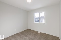 Empty room featuring baseboards and carpet floors - 