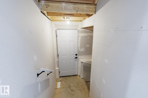 Hallway with concrete flooring - 3719 42 Avenue, Beaumont, AB - Indoor Photo Showing Other Room
