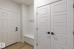 Mudroom featuring light wood-style flooring - 