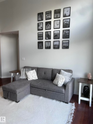 Living area with dark wood-style flooring - 506 10046 110 Street, Edmonton, AB - Indoor Photo Showing Living Room