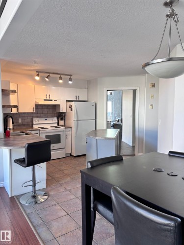 Dining space with a textured ceiling - 506 10046 110 Street, Edmonton, AB - Indoor Photo Showing Kitchen