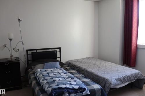 #206 9028 Jasper Ave Nw, Edmonton, AB - Indoor Photo Showing Bedroom