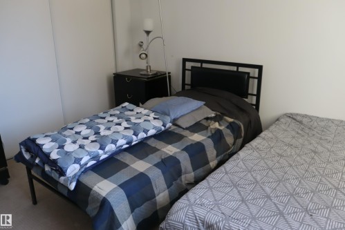 #203 9028 Jasper Ave Nw, Edmonton, AB - Indoor Photo Showing Bedroom