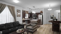 Living area featuring a textured ceiling and light wood-style flooring - 