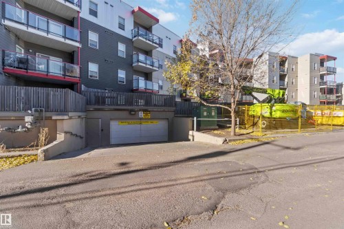 View of apartment building / complex featuring a garage - 107 10611 117 Street, Edmonton, AB - Outdoor