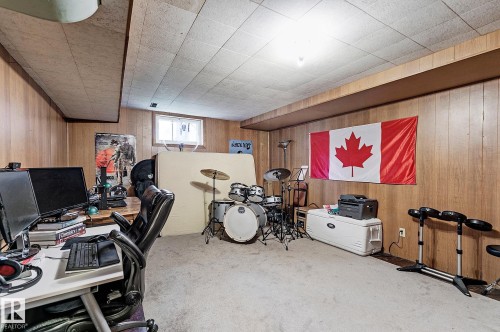 Office with wood walls and light carpet - 11559 80 Avenue, Edmonton, AB - Indoor