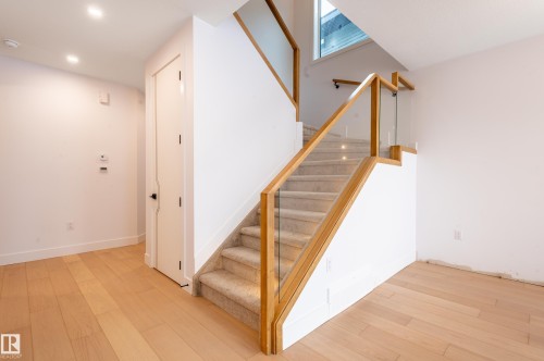 Stairway with hardwood / wood-style flooring and recessed lighting - 43 Eldridge Point(E), St. Albert, AB - Indoor Photo Showing Other Room