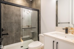 Bathroom with vanity and a stall shower - 