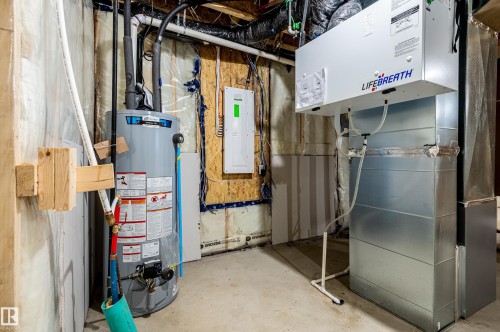 Utility room with heating unit, gas water heater, and electric panel - 43 Eldridge Point(E), St. Albert, AB - Indoor Photo Showing Basement