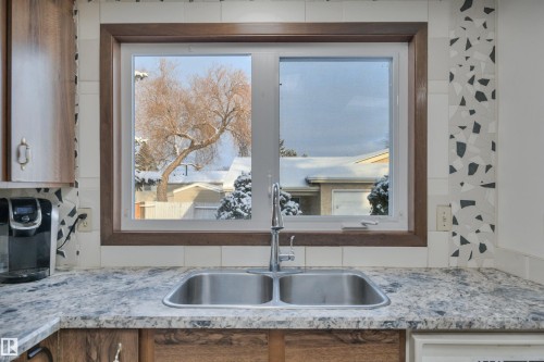4314 39 Avenue, Leduc, AB - Indoor Photo Showing Kitchen With Double Sink