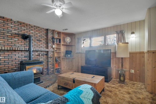 4314 39 Avenue, Leduc, AB - Indoor Photo Showing Living Room With Fireplace
