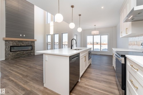 6 Tenuto Link, Spruce Grove, AB - Indoor Photo Showing Kitchen With Fireplace With Upgraded Kitchen