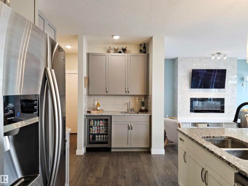 122 Joyal Way, St. Albert, AB - Indoor Photo Showing Kitchen With Fireplace With Double Sink
