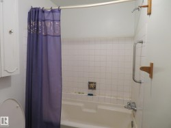 Bathroom with shower / bath combo with shower curtain - 