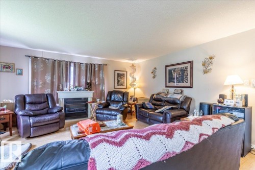 5116 52 St, Warburg, AB - Indoor Photo Showing Living Room With Fireplace